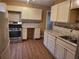 Updated kitchen featuring white cabinets, stainless steel appliances, and modern finishes at 2061 Detroit Nw Ave, Atlanta, GA 30314