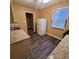 Modern kitchen featuring stainless steel sink, tile floors, white refrigerator, and window at 2061 Detroit Nw Ave, Atlanta, GA 30314