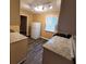 Bright kitchen with stainless steel appliances, gray countertops, modern lighting, and tile floors at 2061 Detroit Nw Ave, Atlanta, GA 30314