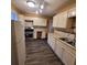 Traditional kitchen featuring a refrigerator, stove, white cabinets and countertops, and gray backsplash at 2061 Detroit Nw Ave, Atlanta, GA 30314