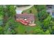 An aerial view of a home showing the expansive deck and lush greenery surrounding the property at 12040 Old Mountain Park Rd, Roswell, GA 30075