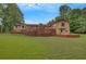 Expansive backyard with a wooden patio perfect for entertaining, with large green yard at 12040 Old Mountain Park Rd, Roswell, GA 30075