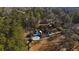 Aerial view of the home with circle driveway surrounded by dense trees at 1325 Whitlock Sw Ave, Marietta, GA 30064