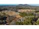 Aerial view of property, including the residence and the surrounding land with a pond at 1325 Whitlock Sw Ave, Marietta, GA 30064