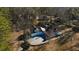 Aerial view of the home with circle driveway surrounded by dense trees at 1325 Whitlock Sw Ave, Marietta, GA 30064