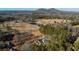 Aerial view of property, including the residence and the surrounding land with a pond at 1325 Whitlock Sw Ave, Marietta, GA 30064