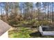 Large, treed backyard and storage shed behind a home with a shingled roof at 1325 Whitlock Sw Ave, Marietta, GA 30064