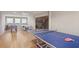 Large recreation room featuring a ping pong table, pool table, and foosball table at 1325 Whitlock Sw Ave, Marietta, GA 30064