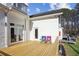 Exterior view of a wooden deck with French doors and a view of the well-kept lawn at 1325 Whitlock Sw Ave, Marietta, GA 30064