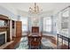 Formal dining room featuring a large table, chandelier, and classic design elements at 1325 Whitlock Sw Ave, Marietta, GA 30064