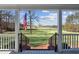 Inviting front porch view with classic white columns and a picturesque landscape beyond at 1325 Whitlock Sw Ave, Marietta, GA 30064