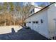 Spacious three-car garage with ample parking space and additional storage, ideal for car enthusiasts at 1325 Whitlock Sw Ave, Marietta, GA 30064