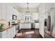 Updated kitchen featuring white cabinets, stainless steel appliances, and natural light at 1325 Whitlock Sw Ave, Marietta, GA 30064