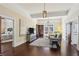 Open-concept living room featuring hardwood floors, a cozy sitting area and natural light at 1325 Whitlock Sw Ave, Marietta, GA 30064