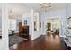 Elegant living room with hardwood floors, chandeliers, and open space for gatherings at 1325 Whitlock Sw Ave, Marietta, GA 30064