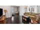 Cozy living room with hardwood floors, built-in bookshelves, and a comfortable seating area at 1325 Whitlock Sw Ave, Marietta, GA 30064