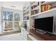 Home office with custom built-in shelving, desk space, and a view of the outdoors at 1325 Whitlock Sw Ave, Marietta, GA 30064