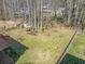 Large backyard featuring a garden area, a fire pit, and a wooden fence at 1532 Boxwood Nw Trce, Acworth, GA 30102