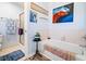 Bright bathroom featuring a tub, separate shower, and colorful artwork at 1532 Boxwood Nw Trce, Acworth, GA 30102