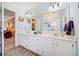 Bathroom with white vanity, a large mirror, and decorative lighting at 1532 Boxwood Nw Trce, Acworth, GA 30102