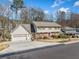 Charming two-story home featuring a spacious driveway, two-car garage, and well-maintained landscaping at 1532 Boxwood Nw Trce, Acworth, GA 30102