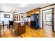 Spacious eat-in kitchen featuring ample cabinet space, a center island, and modern appliances at 1532 Boxwood Nw Trce, Acworth, GA 30102