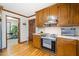 Well-equipped kitchen featuring wood cabinets, stainless steel appliances, and hardwood floors at 1532 Boxwood Nw Trce, Acworth, GA 30102