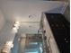 Bathroom featuring a double vanity with granite countertop and stylish lighting fixtures at 3671 Casual Ridge Way, Loganville, GA 30052