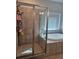 Relaxing bathroom featuring a separate shower and soaking tub, complete with tiled walls and ample natural light at 3671 Casual Ridge Way, Loganville, GA 30052