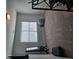This spare bedroom is spacious, with a large window and carpeted floors, and can be easily converted into a home office or gym at 3671 Casual Ridge Way, Loganville, GA 30052