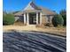 Community clubhouse featuring stone and siding and a covered front entrance at 3671 Casual Ridge Way, Loganville, GA 30052