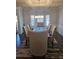 Elegant dining room with a large table, seating for eight, and a beautiful coffered ceiling at 3671 Casual Ridge Way, Loganville, GA 30052