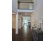 Inviting two-story foyer with hardwood floors, elegant decor, and a view into the spacious living room at 3671 Casual Ridge Way, Loganville, GA 30052