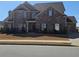 Charming two-story brick home with lush landscaping and a welcoming front entrance at 3671 Casual Ridge Way, Loganville, GA 30052