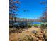 Multiple community tennis courts with black chain link fence and an accessible gazebo at 3671 Casual Ridge Way, Loganville, GA 30052