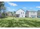 Expansive backyard with lush green lawn, ideal for outdoor activities and enjoying the natural surroundings at 7608 Parkland Bnd, Fairburn, GA 30213