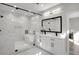 This bathroom features a glass shower, soaking tub, and double vanity at 7608 Parkland Bnd, Fairburn, GA 30213