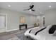 This bedroom has gray wood flooring and recessed lighting at 7608 Parkland Bnd, Fairburn, GA 30213