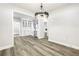 Open kitchen view showcases white cabinets, stainless steel appliances, and modern finishes at 7608 Parkland Bnd, Fairburn, GA 30213