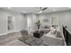 Spacious loft area with comfortable seating, modern decor, and ample natural light at 7608 Parkland Bnd, Fairburn, GA 30213