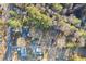 Aerial view showing the vast acreage and tree coverage on the property at 916 Marshall Fuller Rd, Dallas, GA 30157