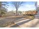 Backyard area features a concrete patio, wooden deck, and plenty of green space at 916 Marshall Fuller Rd, Dallas, GA 30157