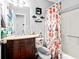 Bathroom featuring a granite vanity top, shower, and decorative shower curtain at 916 Marshall Fuller Rd, Dallas, GA 30157