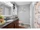 Bathroom featuring a granite vanity top, shower, and decorative shower curtain at 916 Marshall Fuller Rd, Dallas, GA 30157