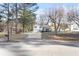 A long driveway leads up to this lovely split-level home, surrounded by mature trees at 916 Marshall Fuller Rd, Dallas, GA 30157