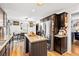 Eat in kitchen features a stainless fridge, wood cabinets and butcher block island at 916 Marshall Fuller Rd, Dallas, GA 30157