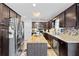 Spacious kitchen with wooden cabinets, stainless steel appliances and butcher block island at 916 Marshall Fuller Rd, Dallas, GA 30157