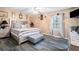 Bedroom with a bed, ceiling fan, window, and stylish decor at 916 Marshall Fuller Rd, Dallas, GA 30157