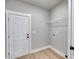 Convenient mudroom featuring a back door, utility hookups, and a wire rack for easy storage at 1765 Harmony Rd, Temple, GA 30179