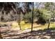 An overview of the landscaped backyard featuring a staircase and fenced-in area at 1837 Haven Park Se Cir, Smyrna, GA 30080